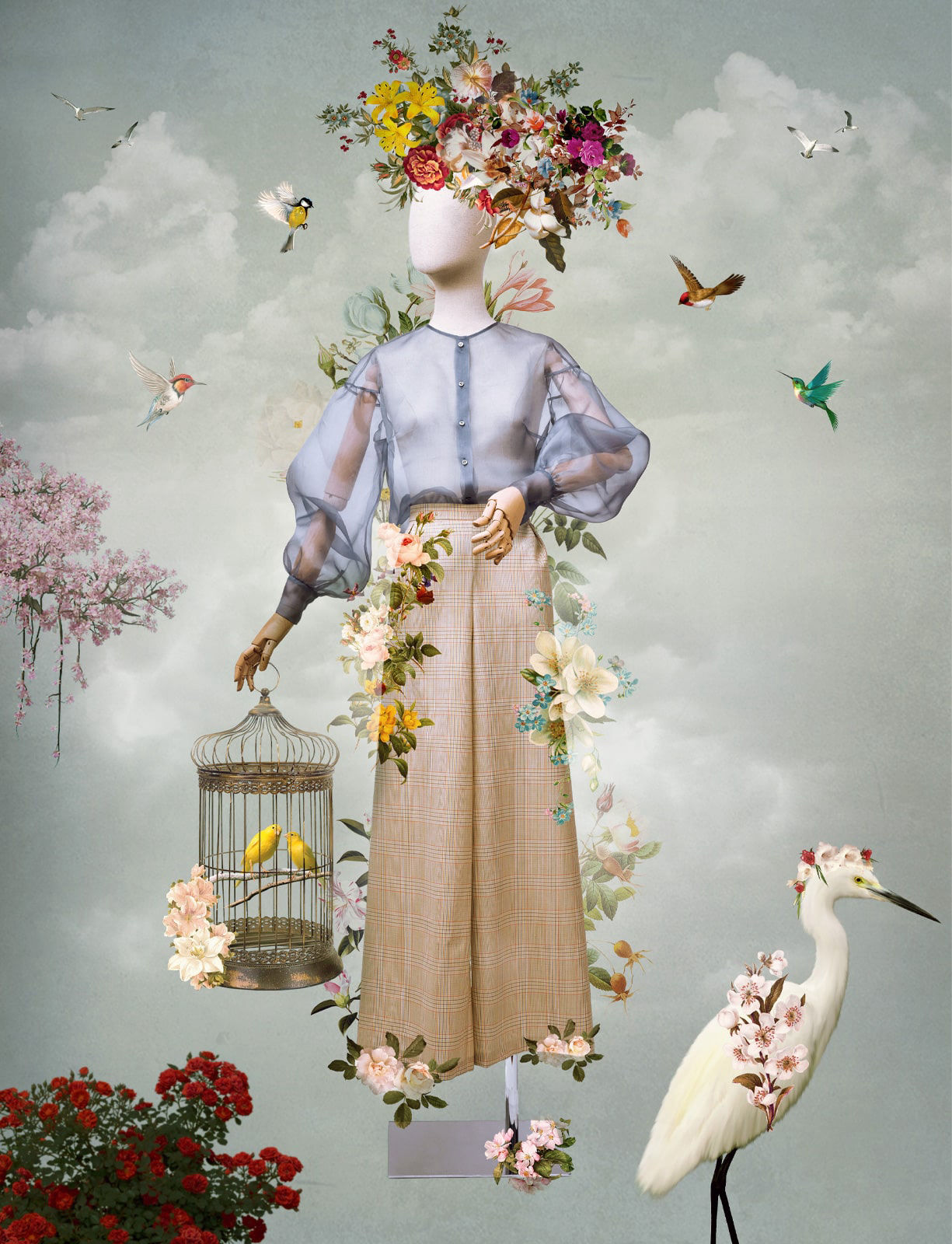 Picture of a mannequin surrounded by flowers and hummingbirds