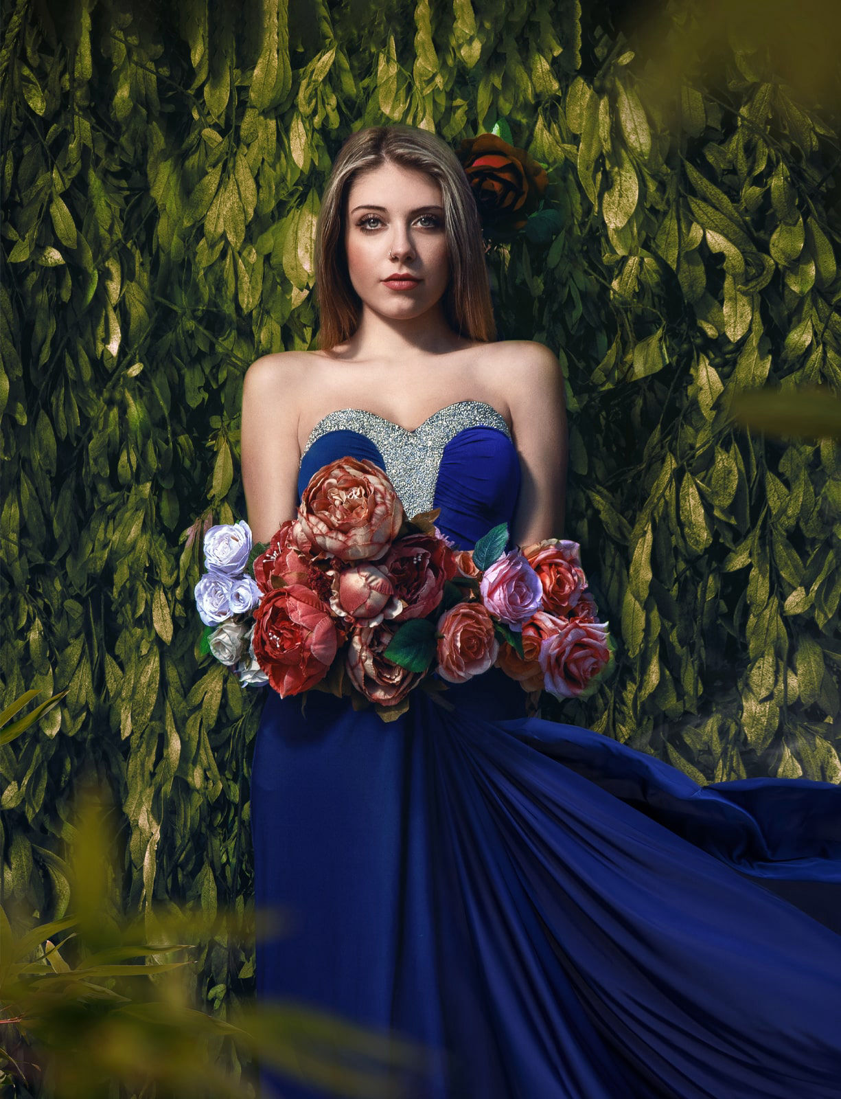 Painterly photography of a model wearing a blu long dress with flowers 