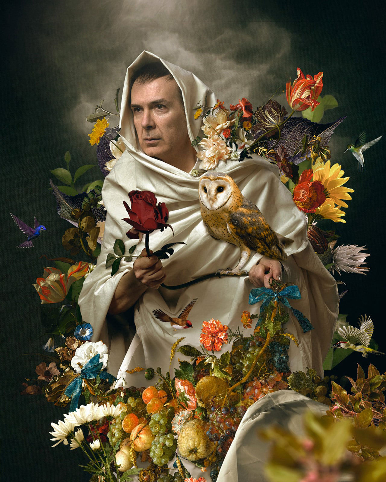 Picture of a mannequin surrounded by flowers and hummingbirds